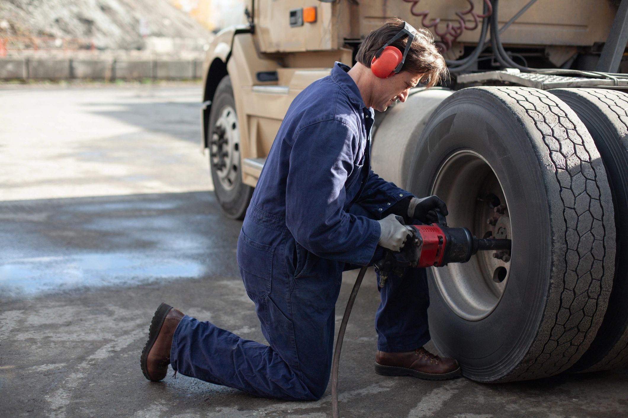 mechanics working on trucks