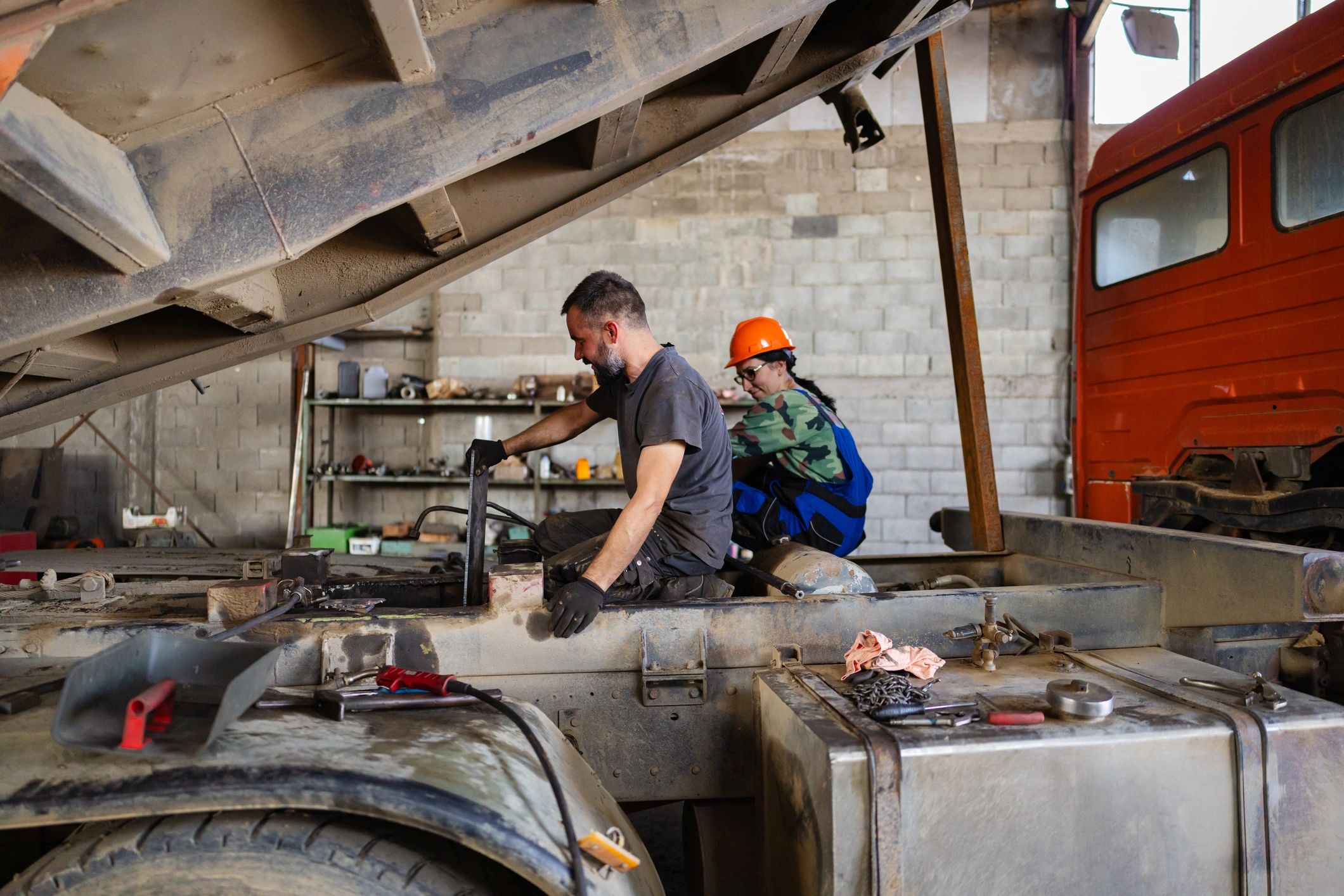 mechanics working on trucks